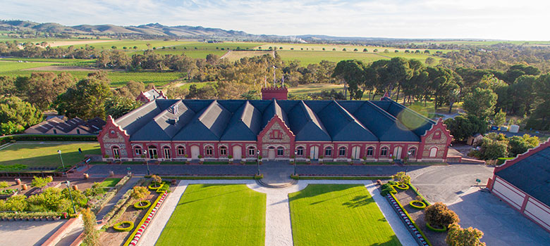 Majestic bluestone winery and expansive vineyard of Château Tanunda in Barossa Valley